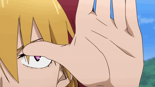 a close up of a person 's face with a hand covering it