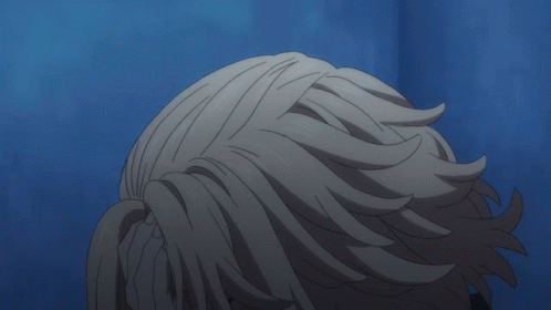 A Close Up Of A Person 'S Face With A Hand On It GIF