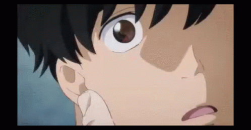 A Close Up Of A Person 'S Face With A Hand On Their Face . GIF
