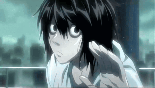A Close Up Of A Person 'S Face With A Hand Outstretched GIF