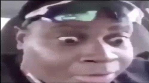 A Close Up Of A Person 'S Face With A Hat On . GIF
