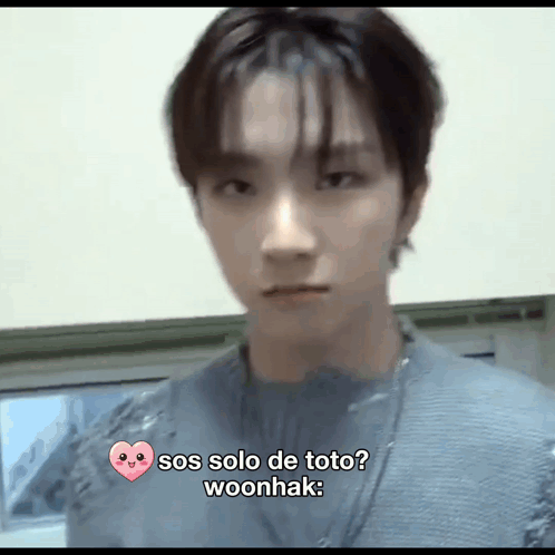 A Close Up Of A Person 'S Face With A Heart And The Words Sos Solo De Toto Woonhak . GIF