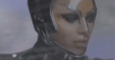 A Close Up Of A Person 'S Face With A Helmet On . GIF