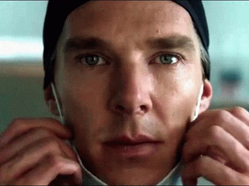 A Close Up Of A Person 'S Face With A Mask On GIF