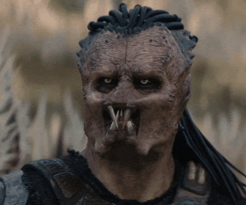 A Close Up Of A Person 'S Face With A Mask On GIF
