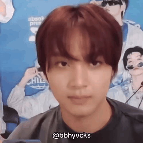A Close Up Of A Person 'S Face With A Microphone In Front Of Them . GIF