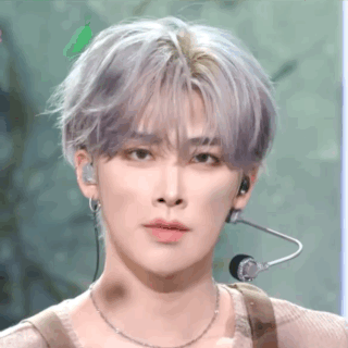 A Close Up Of A Person 'S Face With A Microphone On Their Ear . GIF