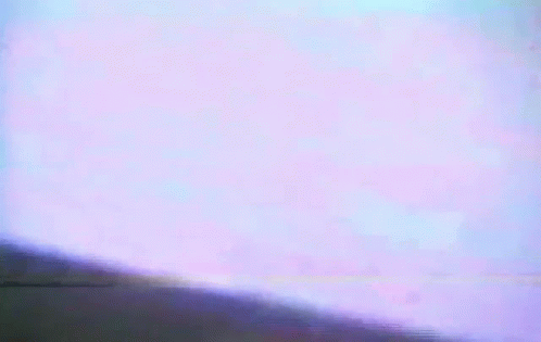 A Close Up Of A Person 'S Face With A Purple Background GIF
