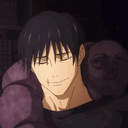 A Close Up Of A Person 'S Face With A Purple Pillow In The Background GIF
