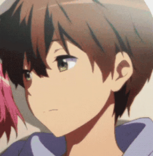 A Close Up Of A Person 'S Face With A Purple Shirt On GIF