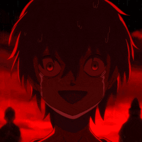 a close up of a person 's face with a red light behind them