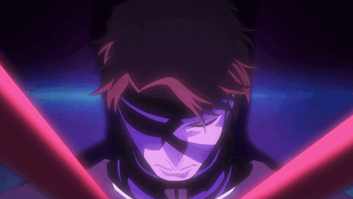 A Close Up Of A Person 'S Face With A Red Light Behind Them GIF