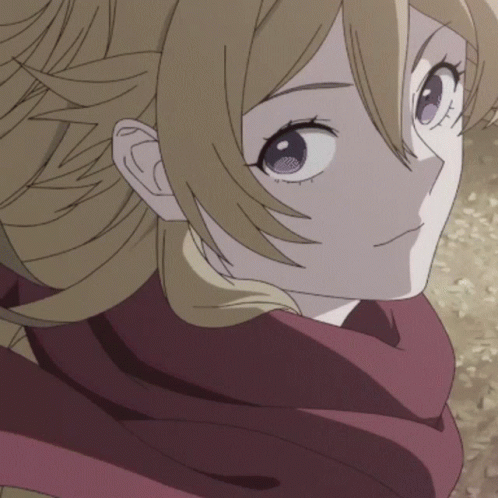 A Close Up Of A Person 'S Face With A Red Scarf Around Their Neck GIF