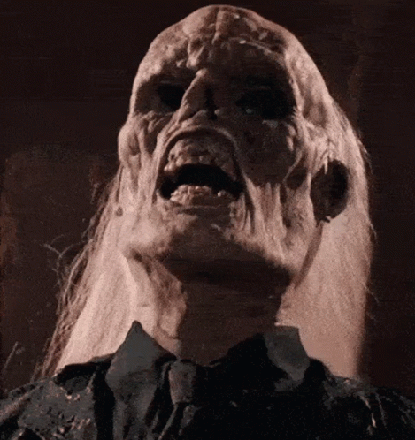 A Close Up Of A Person 'S Face With A Screaming Expression GIF