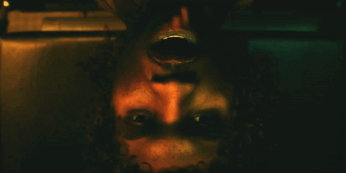 A Close Up Of A Person 'S Face With A Shadow On It GIF