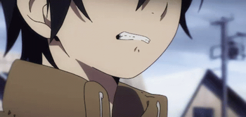 A Close Up Of A Person 'S Face With A Slight Smirk On His Face GIF
