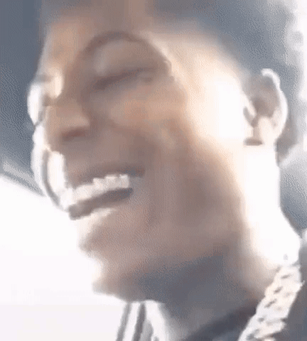 A Close Up Of A Person 'S Face With A Smile On It . GIF