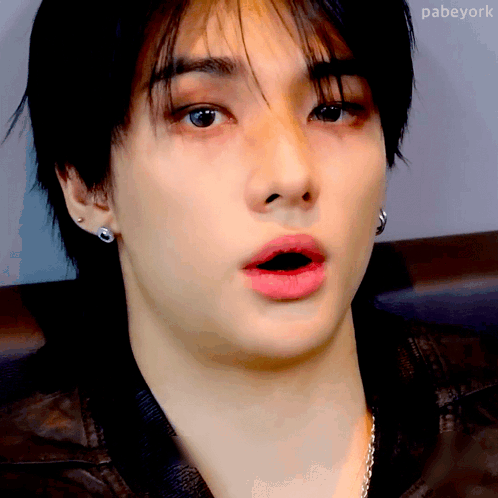 A Close Up Of A Person 'S Face With A Surprised Look On His Face . GIF