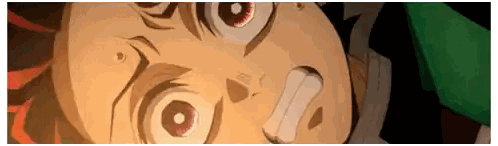 a close up of a person 's face with a surprised look on his face
