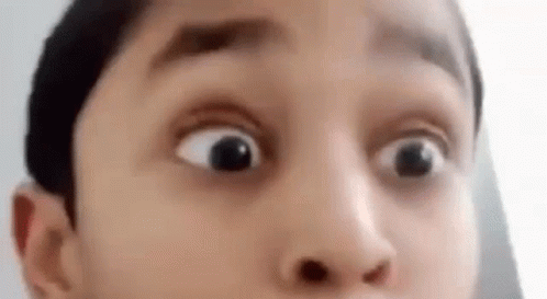 A Close Up Of A Person 'S Face With A Surprised Look On It . GIF