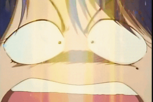 A Close Up Of A Person 'S Face With A Surprised Look On It GIF