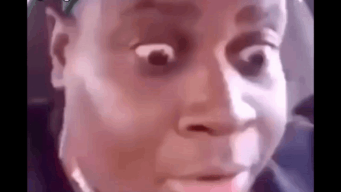 A Close Up Of A Person 'S Face With A Surprised Look On It . GIF
