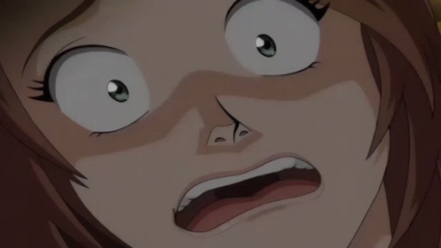 A Close Up Of A Person 'S Face With A Surprised Look On Their Face GIF