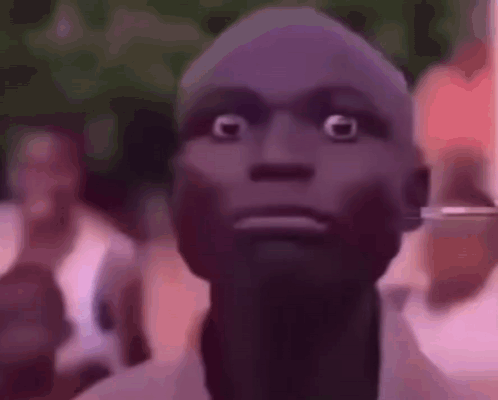 A Close Up Of A Person 'S Face With A Surprised Look On Their Face . GIF
