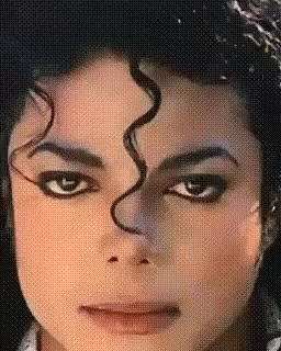 A Close Up Of A Person 'S Face With A Swirl In The Hair GIF