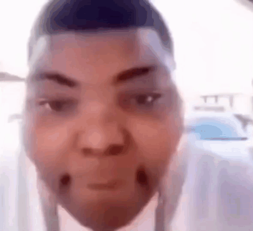 A Close Up Of A Person 'S Face With A Very Funny Face . GIF