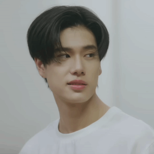 A Close Up Of A Person 'S Face With A White Shirt GIF