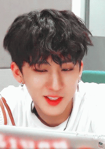 A Close Up Of A Person 'S Face With A White Shirt On GIF