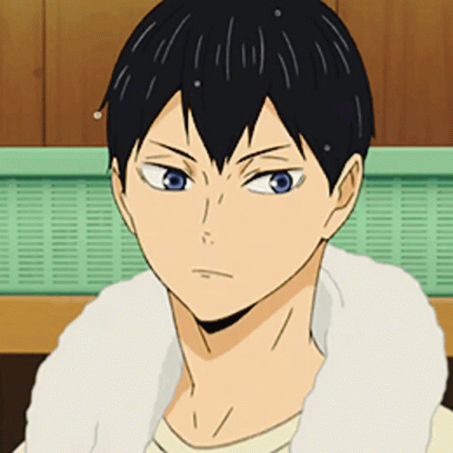 A Close Up Of A Person 'S Face With A White Towel Around Their Neck . GIF