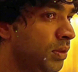 A Close Up Of A Person 'S Face With A Yellow Background GIF