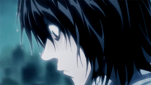 A Close Up Of A Person 'S Face With Black Hair GIF