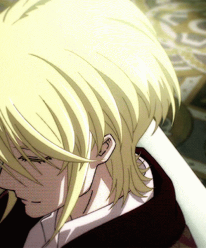 A Close Up Of A Person 'S Face With Blonde Hair And A White Shirt GIF