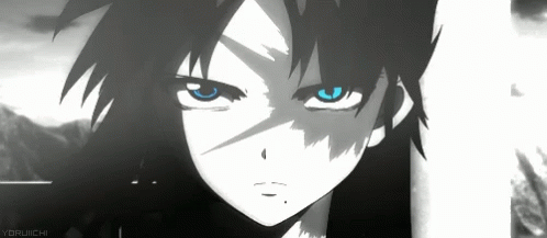A Close Up Of A Person 'S Face With Blue Eyes And Black Hair . GIF