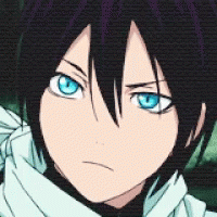 A Close Up Of A Person 'S Face With Blue Eyes And Black Hair GIF