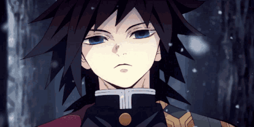A Close Up Of A Person 'S Face With Blue Eyes And Black Hair GIF