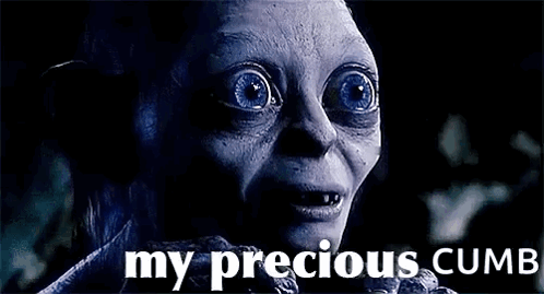 A Close Up Of A Person 'S Face With Blue Eyes And The Words `` My Precious Cumb '' . GIF