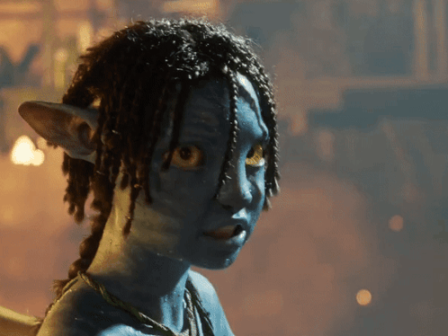 A Close Up Of A Person 'S Face With Blue Paint On It GIF