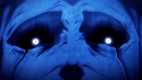 a close up of a person 's face with bright blue eyes