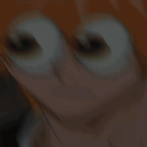 A Close Up Of A Person 'S Face With Cartoon Eyes GIF