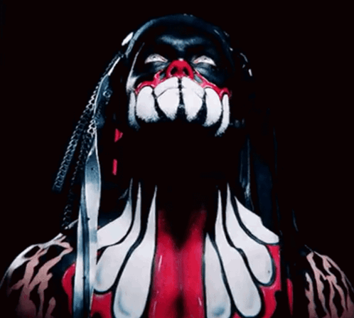 A Close Up Of A Person 'S Face With Dreadlocks And Red And White Paint GIF
