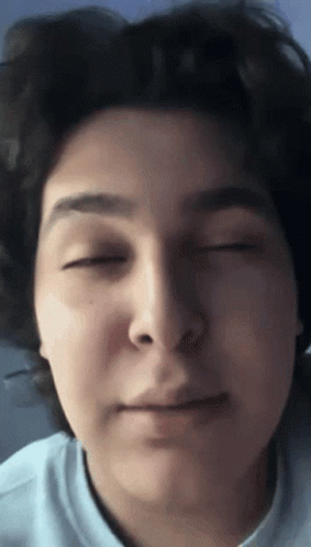 A Close Up Of A Person 'S Face With Eyes Closed GIF
