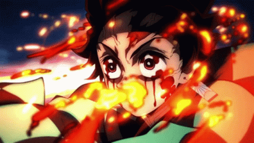 A Close Up Of A Person 'S Face With Fire Coming Out Of His Mouth GIF
