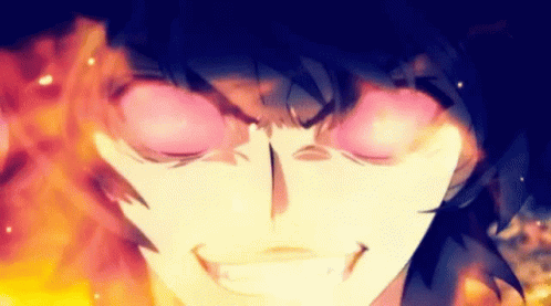 A Close Up Of A Person 'S Face With Flames Coming Out Of It 'S Eyes GIF