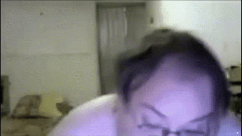 A Close Up Of A Person 'S Face With Glasses On . GIF