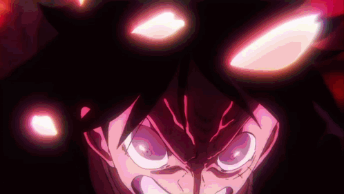 A Close Up Of A Person 'S Face With Glowing Eyes In The Dark . GIF