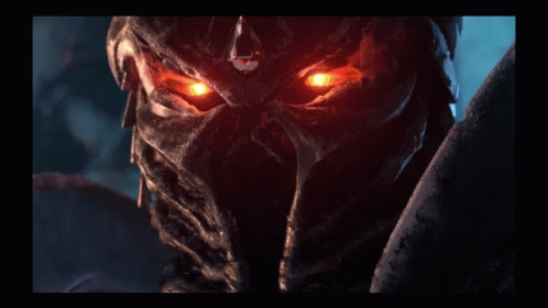 A Close Up Of A Person 'S Face With Glowing Eyes GIF